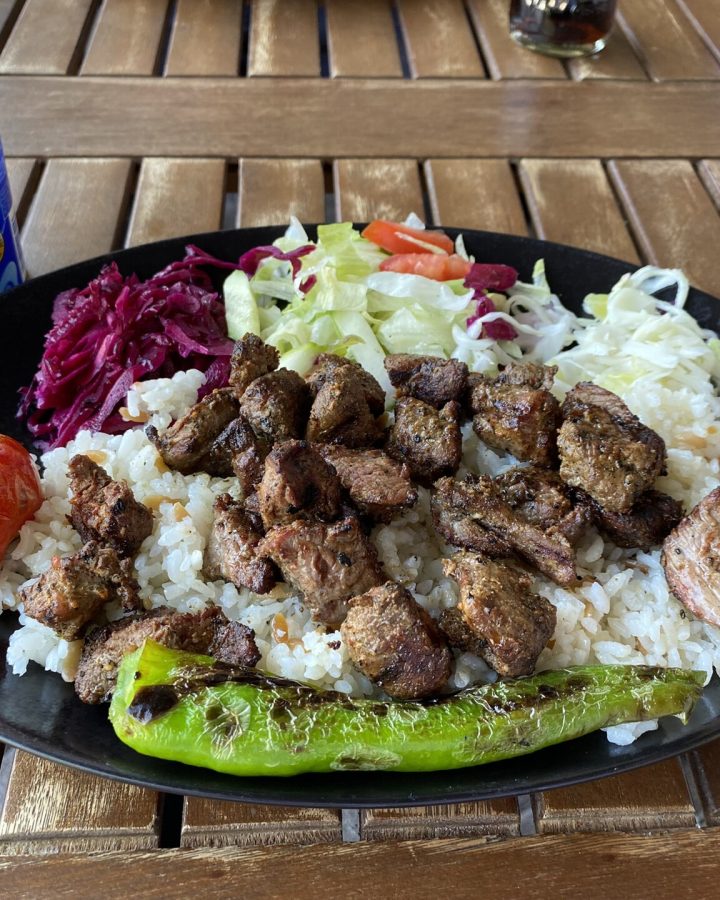 Grilled lamb kebab with rice and vegetables