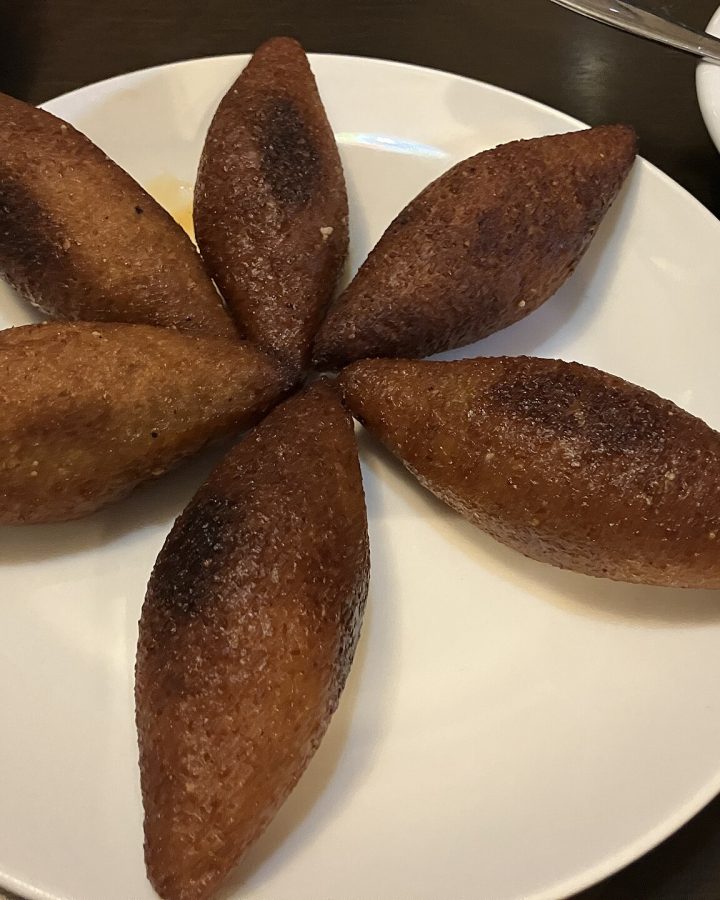 Fried kibbeh on a white plate